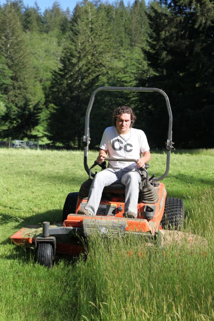 Man Driving a Riding Mower